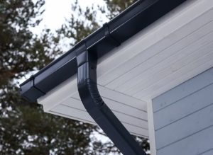 Profiled metal roof drainage system